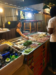 Grilled meat vendor at the night market in Chiang Mai, Thailand
