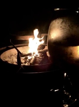 Wine by the fire at our Airbnb in Fredericksburg, Texas