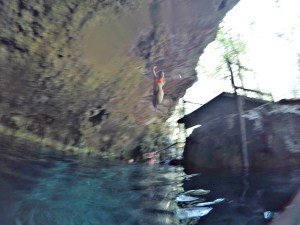 Jumping into the waters of a cenote in Tulum, Mexico