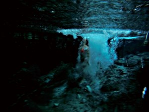 Jumping into a cenote in Tulum, Mexico