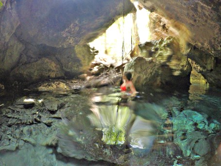 Exploring the waters of a cenote in Tulum, Mexico