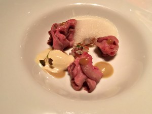 Thin slices of tri tip steak over foie gras royal at Passion by Martín Berasategui in Playa Del Carmen