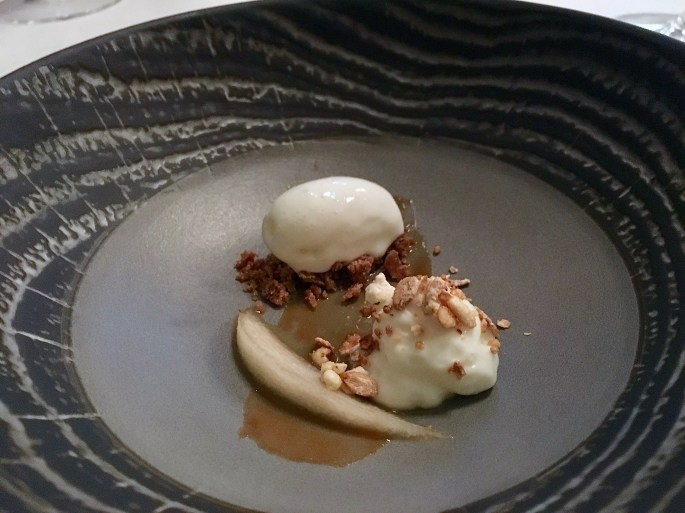 Milk ice cream, goat cheese, caramelized rice and pear compote.