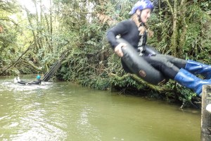 Practicing cave jumping for the Black Labyrinth Tour in Waitomo, New Zealand