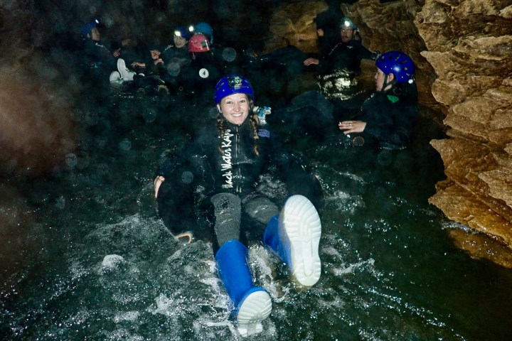 Cave jumping for the Black Labyrinth Tour in Waitomo, New Zealand